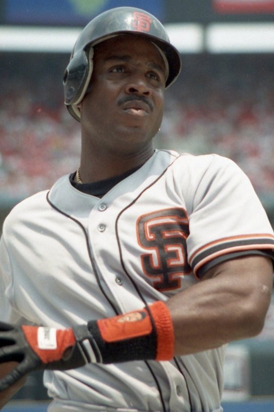 Barry Bonds on deck in a gray San Francisco Giants road uniform and batting helmet, 1993