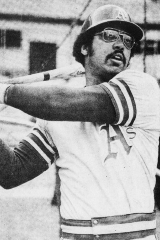 Reggie Jackson in an Oakland Athletics batting helmet and jersey, bat on his shoulder, before Game 3 of the 1973 World Series