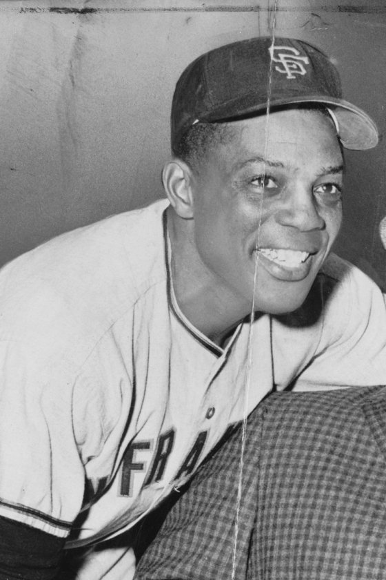 Willie Mays smiling in a San Francisco Giants cap and road jersey, 1961